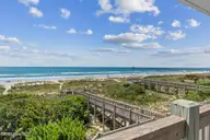 7803 Ocean Drive East, Emerald Isle, NC 28594 — 4-bedroom waterfront townhome, Emerald Isle, NC, photo 2 of 62: 7803_E_Ocean_Drive_#E_037_1
