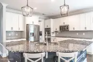 357 Wheatfield Way, Whispering Pines, NC 28327 — 5-bedroom home in Summerfield at Arrowstone, Whispering Pines, NC, photo 12 of 44: Kitchen with Stainless Steel Appliances