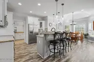 117 Oak Summit Drive, Pikeville, NC 27863 — 3-bedroom home in Oak Summit, Pikeville, NC, photo 13 of 59: 117 Oak Summit Dr Kitchen Breakfast Bar
