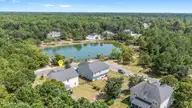 3008 Arundel Hill SW, Shallotte, NC 28470 — 4-bedroom home in Rutledge, Shallotte, NC, photo 3 of 45: Front porch lake view!