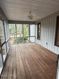 120 Sandham Court, Seven Lakes, NC 27376 — 2-bedroom townhome in Seven Lakes South, Seven Lakes, NC, photo 22 of 33: Screened porch