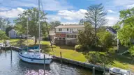904 Coral Court, New Bern, NC 28560 — 4-bedroom waterfront home in Fairfield Harbour, New Bern, NC, photo 2 of 64: Deep water Dock