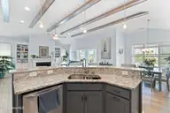 6415 Bryson Drive SW, Ocean Isle Beach, NC 28469 — 3-bedroom home in Retreat At OIB, Ocean Isle Beach, NC, photo 19 of 64: Kitchen to LR