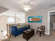129 Sunset Drive, Cedar Point, NC 28584 — 3-bedroom waterfront home in Plantation Shores, Cedar Point, NC, photo 21 of 46: 022-1280x960-upstairs-bonus-areaLof