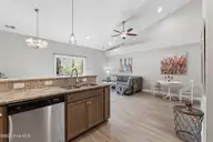 155 Lincoln Place Circle, Leland, NC 28451 — 3-bedroom townhome in Lincoln Place Townhomes, Leland, NC, photo 16 of 39: Kitchen and Living room
