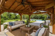13009 Bending River Way, Leland, NC 28451 — 4-bedroom waterfront home in Hawkeswater at the River, Leland, NC, photo 11 of 69: Pergola