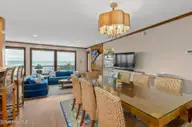 111 Dogwood Circle, Pine Knoll Shores, NC 28512 — 4-bedroom waterfront home in Pine Knoll Association, Pine Knoll Shores, NC, photo 18 of 52: Dining room to living room