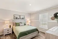 6745 Lewis Drive SE, Winnabow, NC 28479 — 3-bedroom manufactured home in Lewis Acres, Winnabow, NC, photo 15 of 28: Master bedroom