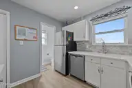 3802 Island Drive, North Topsail Beach, NC 28460 — 3-bedroom waterfront townhome in MFBostic, North Topsail Beach, NC, photo 24 of 49: Kitchen & 1/2 Bath