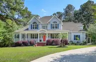 114 Killdeer Drive, Hampstead, NC 28443 — 4-bedroom waterfront home in Pelican Reef, Hampstead, NC, photo 1 of 57: 001_img_2642_8102