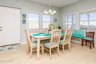 1131 S Shore Drive, Surf City, NC 28445 — 4-bedroom waterfront home in Horse Hammock, Surf City, NC, photo 7 of 40: Dining Table