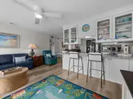 9201 Coast Guard Road C101, Emerald Isle, NC 28594 — 3-bedroom waterfront condo in Pebble Beach, Emerald Isle, NC, photo 8 of 41: Living into Kitchen View