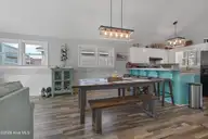 430 3rd Street, Sunset Beach, NC 28468 — 3-bedroom home, Sunset Beach, NC, photo 17 of 48: Coastal Dining Area with bar seating