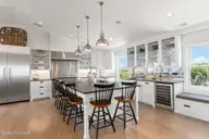 585 Forest Dunes Drive, Pine Knoll Shores, NC 28512 — 4-bedroom waterfront home in Beacon's Reach, Pine Knoll Shores, NC, photo 9 of 68: Gourmet kitchen w/ oversized pantry