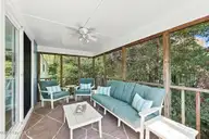 118 Periwinkle Drive, Emerald Isle, NC 28594 — 3-bedroom home in Shell Cove, Emerald Isle, NC, photo 14 of 39: 14 Screened porch off upstairs living