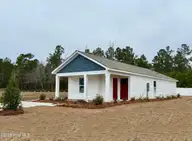 240 Ashworth Drive, Tabor City, NC 28463 — 3-bedroom home in Cottonwood, Tabor City, NC, photo 17 of 17: Cottonwood lot 41 side