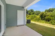 228 Cline Way Unit 131, Beaufort, NC 28516 — 3-bedroom townhome in 1809 Live Oak, Beaufort, NC, photo 5 of 37: Covered Patio with Storage