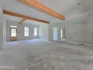203 Gaston Drive, Elizabeth City, NC 27909 — 3-bedroom waterfront home in Newbegun Land, Elizabeth City, NC, photo 5 of 18: Great room view 2