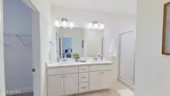 120 Edgewater Drive, West End, NC 27376 — 3-bedroom home in Seven Lakes North, West End, NC, photo 21 of 44: primary ensuite