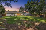 143 Ashbury Park Lane, Richlands, NC 28574 — 3-bedroom home in Ashbury Park, Richlands, NC, photo 2 of 29: 143 Ashbury Twilight Back