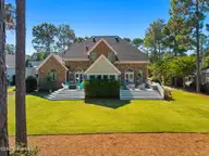3708 Fairfield Way, Southport, NC 28461 — 4-bedroom waterfront home in St James, Southport, NC, photo 8 of 75: Dual Decks | Sunroom in Center