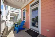 233 Sea Dreams Drive, Atlantic Beach, NC 28512 — 3-bedroom home in Sea Dreams, Atlantic Beach, NC, photo 4 of 68: left front proch