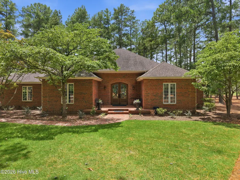 39 Devon Drive, Pinehurst, NC 28374 — 3-bedroom home in Pinewild CC, Pinehurst, NC, photo 1 of 31: 3-web-or-mls-DJI_20260721141154_0697_D -