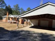 19 Wilkins Road, Belhaven, NC 27810 — 4-bedroom home, Belhaven, NC, photo 13 of 61: 13 Side of house with garage