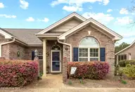 619 Elfin Court, Leland, NC 28479 — 2-bedroom waterfront townhome in Westport, Leland, NC, photo 1 of 38: Front View 619 Elfin