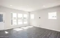 5331 Folklore Way, Wilmington, NC 28412 — 3-bedroom home in Riverlights, Wilmington, NC, photo 9 of 25: Raymond Gathering Space with Natural Lig