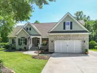 130 Wild Berry Lane, Hampstead, NC 28443 — 5-bedroom waterfront home in Bent Tree, Hampstead, NC, photo 1 of 75