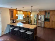 515 Fairway Drive W, Sunset Beach, NC 28468 — 3-bedroom home in Sea Trail Plantation, Sunset Beach, NC, photo 11 of 25: kitchen Mann 3