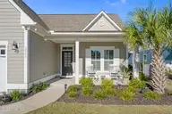 2267 Reefside Loop NE, Leland, NC 28451 — 3-bedroom home in Compass Pointe, Leland, NC, photo 6 of 71: front porch