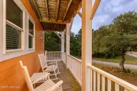 200 Shipwreck Lane, Emerald Isle, NC 28594 — 3-bedroom waterfront home in Spinnakers Reach, Emerald Isle, NC, photo 19 of 59: Covered porch off Primary bedroom 1