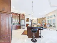 8900 Mahogany Run, Wilmington, NC 28411 — 3-bedroom home in Porters Neck Plantation, Wilmington, NC, photo 19 of 75: 30-web-or-mls-31_STILL082_kitchen