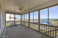 1711 E Fort Macon Road, Atlantic Beach, NC 28512 — 4-bedroom waterfront home in Asbury Beach, Atlantic Beach, NC, photo 15 of 42: Screened in Porch