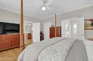 134 Wild Berry Lane, Hampstead, NC 28443 — 5-bedroom waterfront home in Bent Tree, Hampstead, NC, photo 15 of 46: Owners Suite