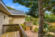 106 Cherry Court, Pine Knoll Shores, NC 28512 — 3-bedroom waterfront home in Pine Knoll Association, Pine Knoll Shores, NC, photo 21 of 63: Deck off of Primary Bedroom