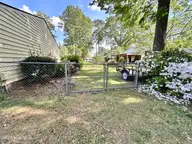218 Pamlico Drive, Washington, NC 27889 — 3-bedroom home in Pamlico Village, Washington, NC, photo 4 of 38: 004 Fenced Back Yard with Gate