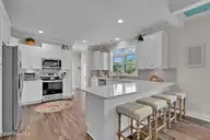7202 E Yacht Drive, Oak Island, NC 28465 — 3-bedroom waterfront home in Tranquil Harbor, Oak Island, NC, photo 11 of 61: 7202 E Yacht Dr-2