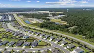 420 St Kitts Way, Winnabow, NC 28479 — 3-bedroom home in Mallory Creek Plantation, Winnabow, NC, photo 20 of 33: Drone