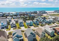 115 E Bogue Boulevard, Atlantic Beach, NC 28512 — 3-bedroom home in The Cottages @ The Grove, Atlantic Beach, NC, photo 2 of 50: 10-web-or-mls-DJI_20260320130417_0074_D