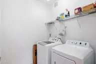 613 Elfin Court, Leland, NC 28479 — 2-bedroom townhome in Westport, Leland, NC, photo 21 of 28: Laundry