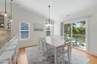 106 Wyndward Court, Emerald Isle, NC 28594 — 4-bedroom home in Wyndtree, Emerald Isle, NC, photo 13 of 63: Dining area with deck access