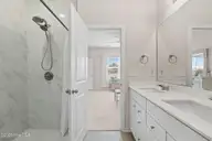 9414 Barnstormer Drive, Carolina Shores, NC 28467 — 3-bedroom waterfront home in Eagle Run, Carolina Shores, NC, photo 22 of 41: Primary Bathroom