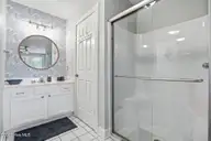908 Resort Circle Unit 510, Sunset Beach, NC 28468 — 1-bedroom condo in Colony II, Sunset Beach, NC, photo 17 of 30: Walk-in shower