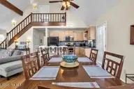 6707 Kings Lynn Drive, Oak Island, NC 28465 — 3-bedroom waterfront home in Kings Lynn, Oak Island, NC, photo 11 of 51: 6707 din table