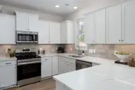 228 S Bandwheel Way, Hampstead, NC 28443 — 4-bedroom home in Sawyers Run, Hampstead, NC, photo 7 of 31: kitchen-01b