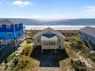 2011 W Beach Drive, Oak Island, NC 28465 — 4-bedroom waterfront home in W. Long Beach, Oak Island, NC, photo 2 of 51: 11-web-or-mls-DJI_20251031125526_0307_D