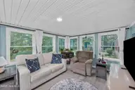 721 Blue Sail Drive SE, Bolivia, NC 28422 — 2-bedroom manufactured home in River Run Plantation, Bolivia, NC, photo 9 of 59: 30_sun room